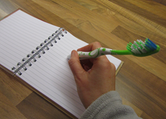Apraxia write with toothbrush